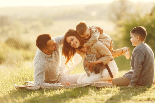 Family playing in summer field