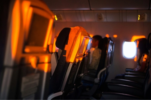 Interior of airplane with warm orange sunlight